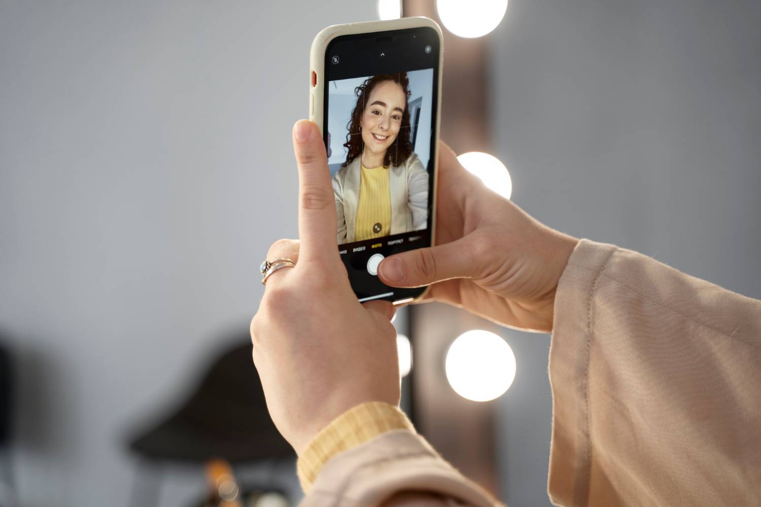 Smartphone displaying blog promotion on Instagram, with trendy outfit and soft lighting.